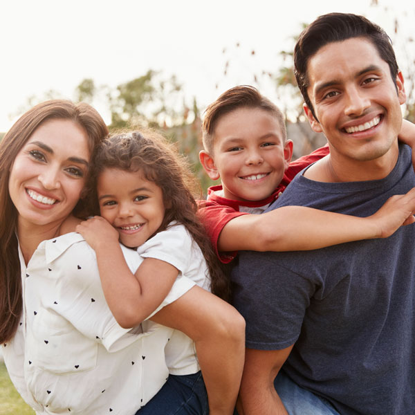 A Smiling Family of Four After Getting Custom Mouth Guards for Protection in Pflugerville, TX.